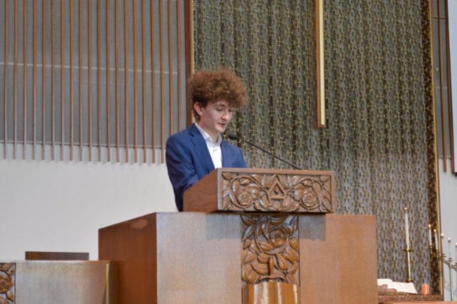 Young man standing in the pulpit at Waterford Central UMC in Michigan