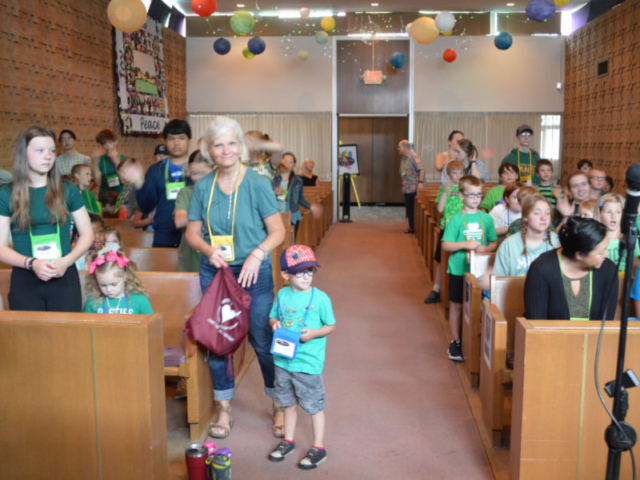 Kids sitting in the Chapel of Central UMC in Waterford MI during summer vacation bible school