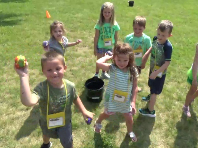 Three boys and three girls throwing water logged Sploosh balls at the camerman at Central's VBS in Waterford, MI
